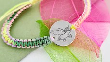 Bratara SARA colectia Our Children - Banut cu desen unicorn din Argint 925 - Snur multicolor impletit Bratara SARA colectia Our Children - Banut cu desen unicorn din Argint 925 - Snur multicolor impletit